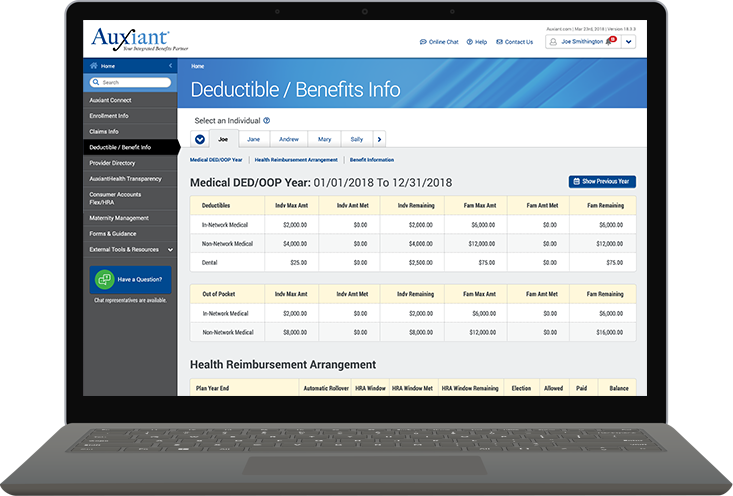 Employee standing by elevator with core values display.