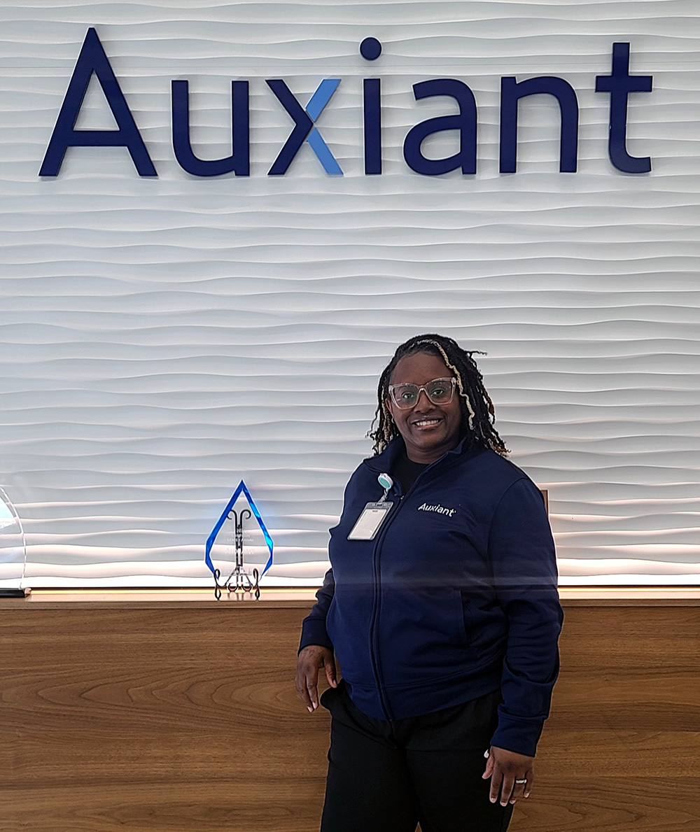 Sugar stands with award