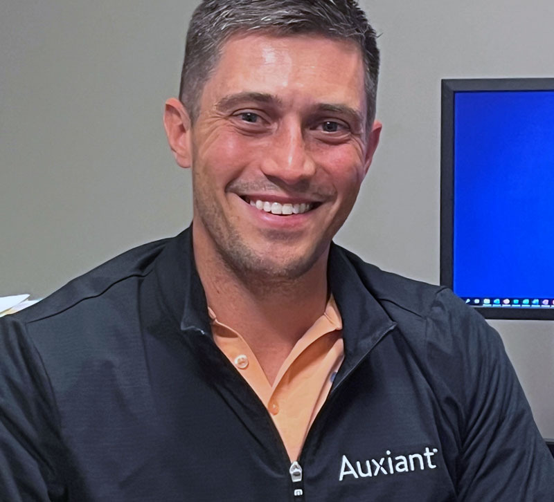 Close up of a happy coworkers face.